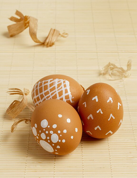 high-angle-painted-eggs-easter-with-copy-space.jpg  